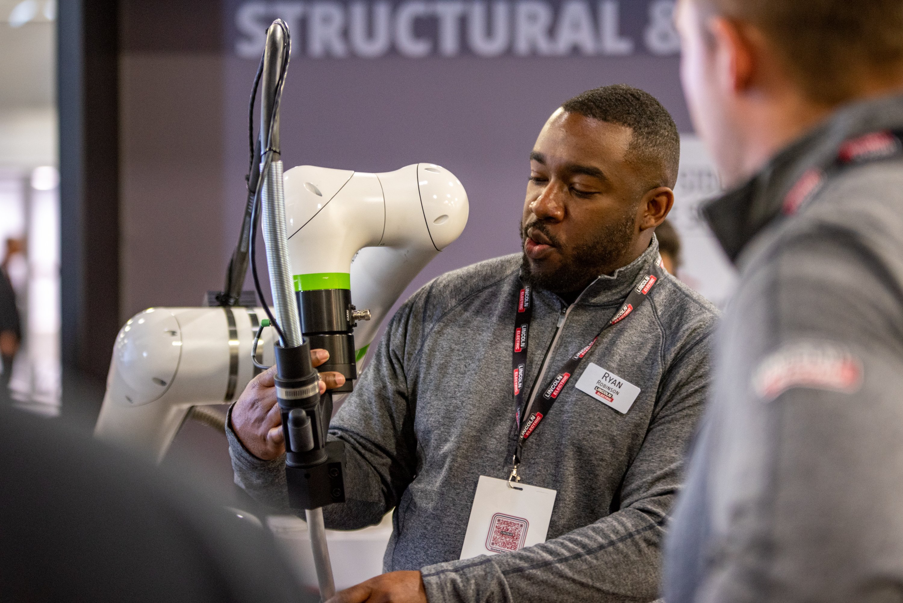 Man testing out a Lincoln Electric tool. 