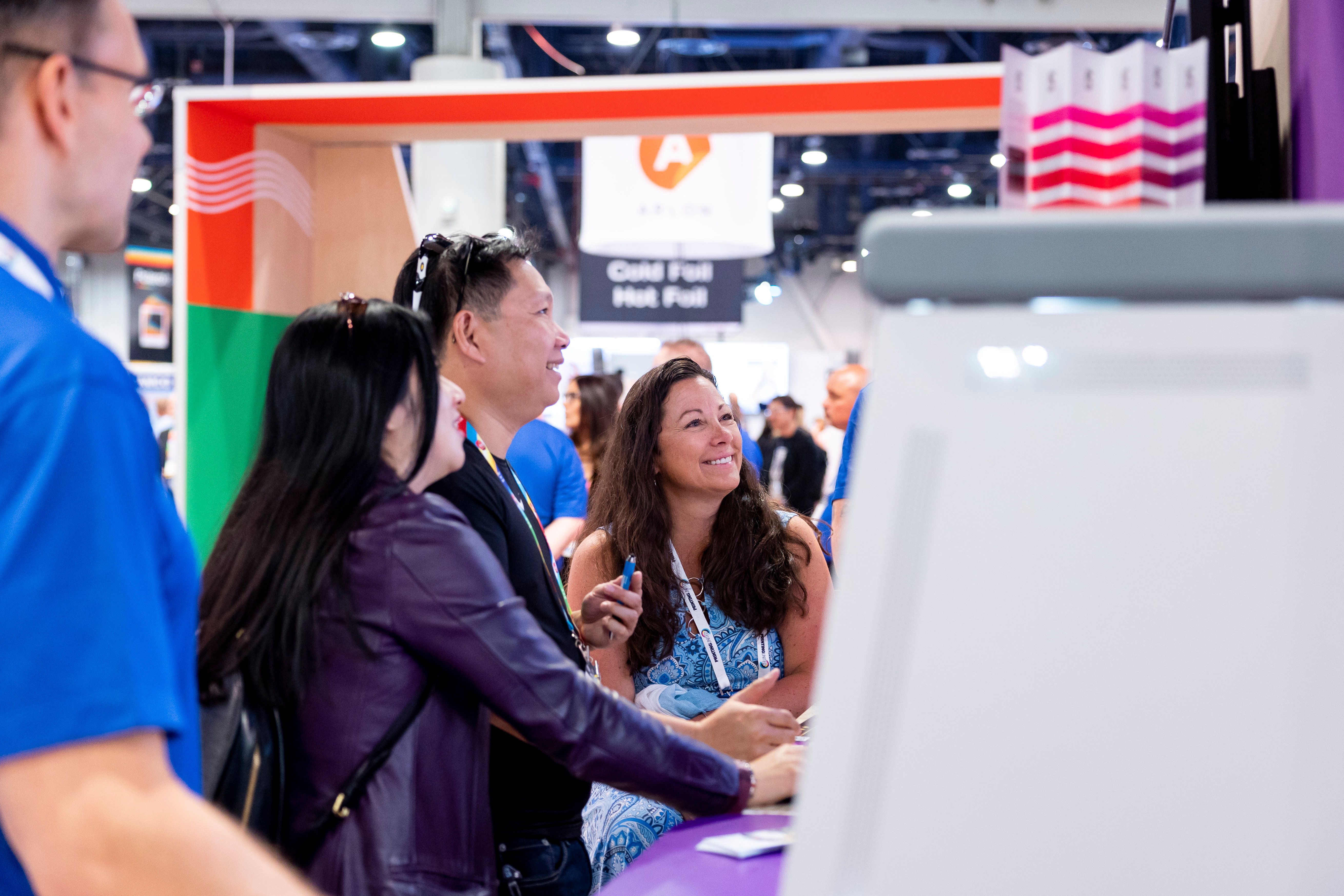 Smiling women looking at a screen